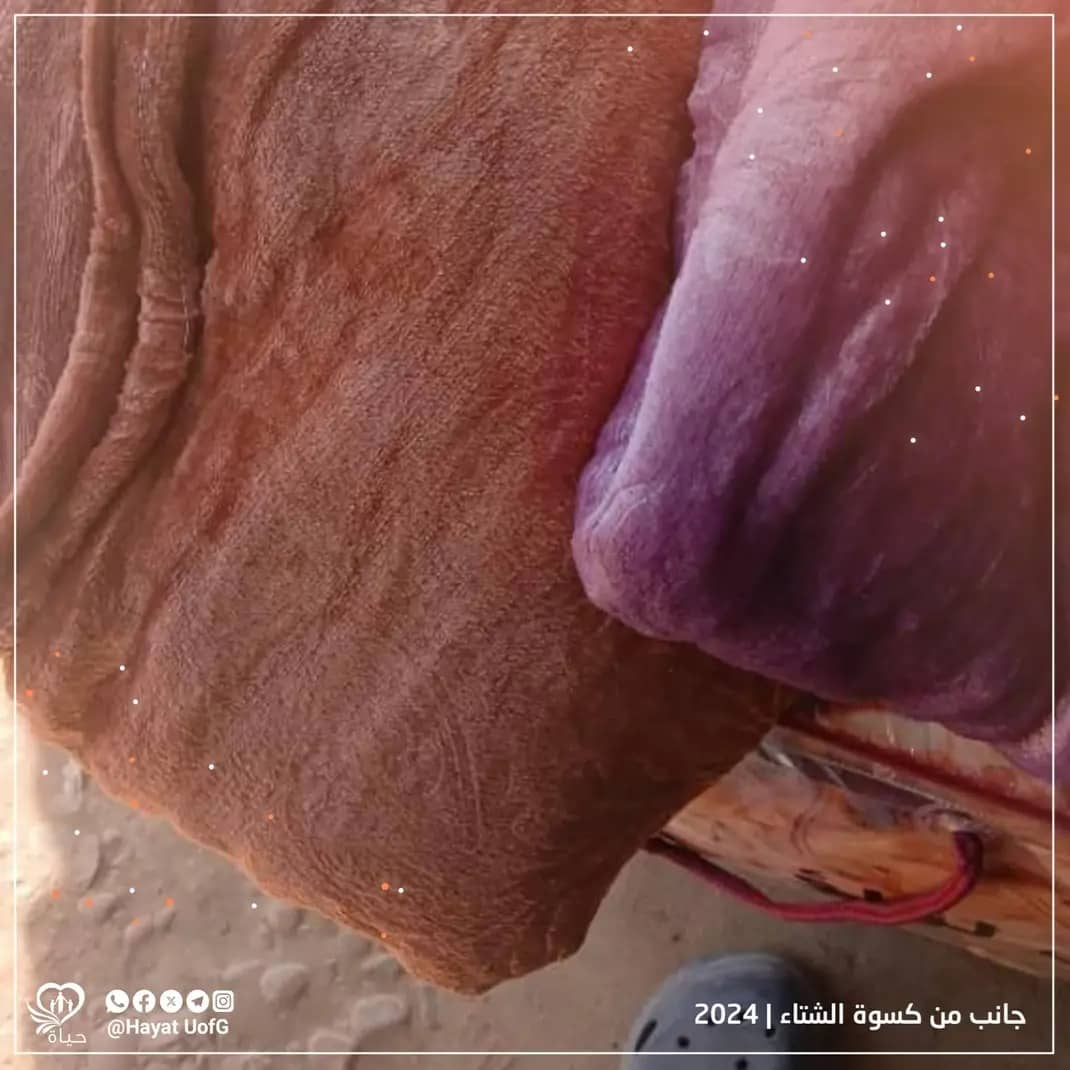 توزيع ملابس شتوية للأطفال